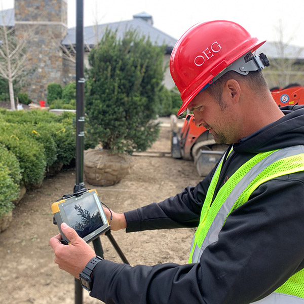 OEG team member in field doing site analysis