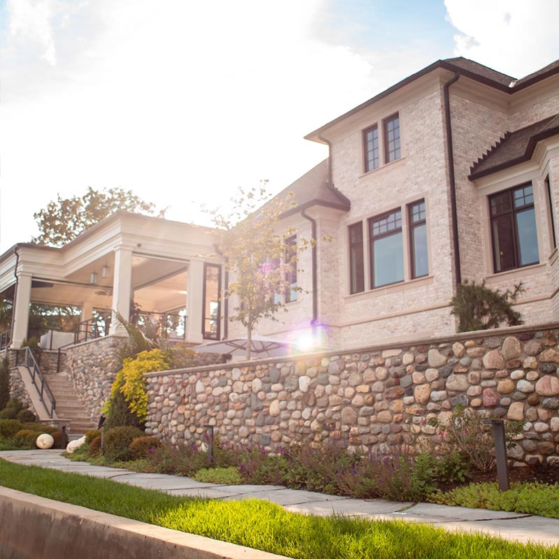 Stone landscaping wall and custom paver walkway